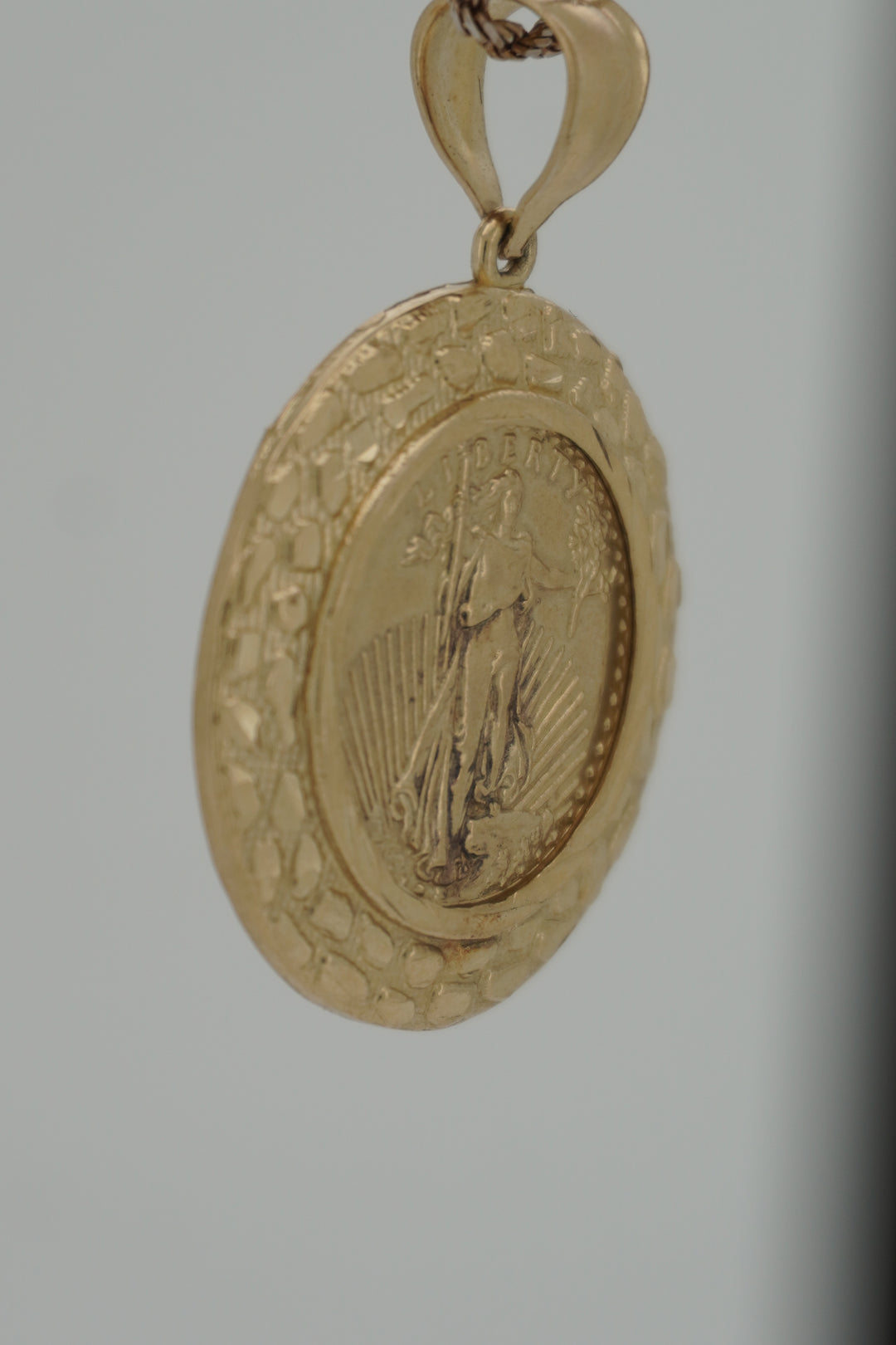 10K YELLOW GOLD LIBERTY WITH NUGGET DESIGN PENDANT