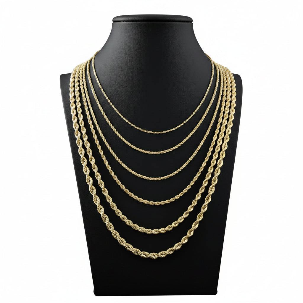 Gold chain necklaces displayed on a black mannequin bust.