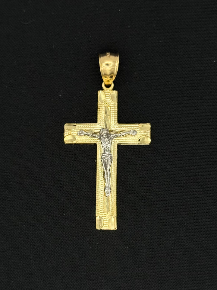 10K GOLD DIA CUT 3D CROSS PENDANT WITH WHITE GOLD JESUS ON IT