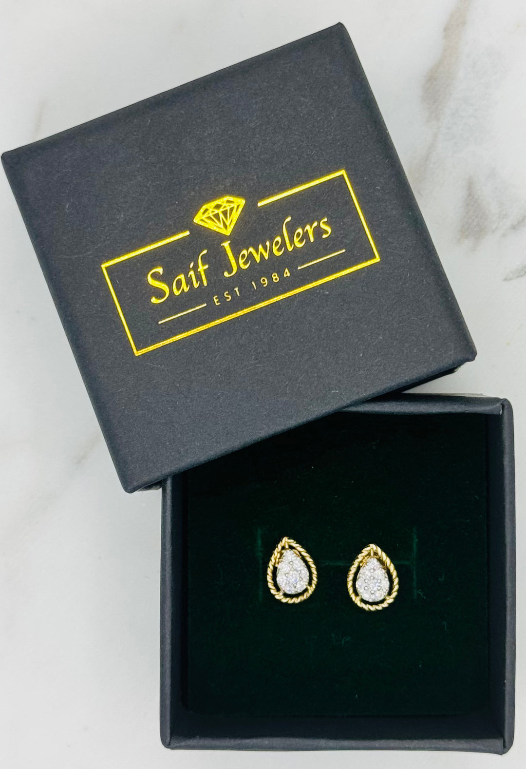 10K GOLD DIAMOND PEAR DESIGN STUDS